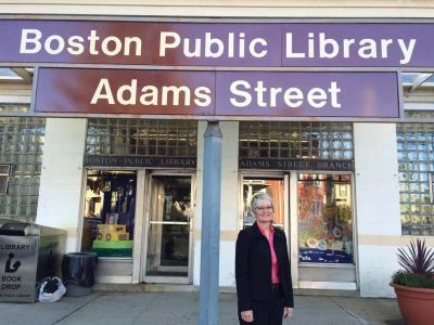 The Adams Street Branch of the Boston Public Library is on the agenda, Patricia Lyons said. Standing in front of the rusted library sign, she said her department will be conducting a comprehensive study of the facilities before bringing in a designer. That process could take 6 to 8 months, Lyons said. The building needs some attention, but “it’s exciting to get to work on something in your own neighborhood,” she added. 	Jennifer Smith photo